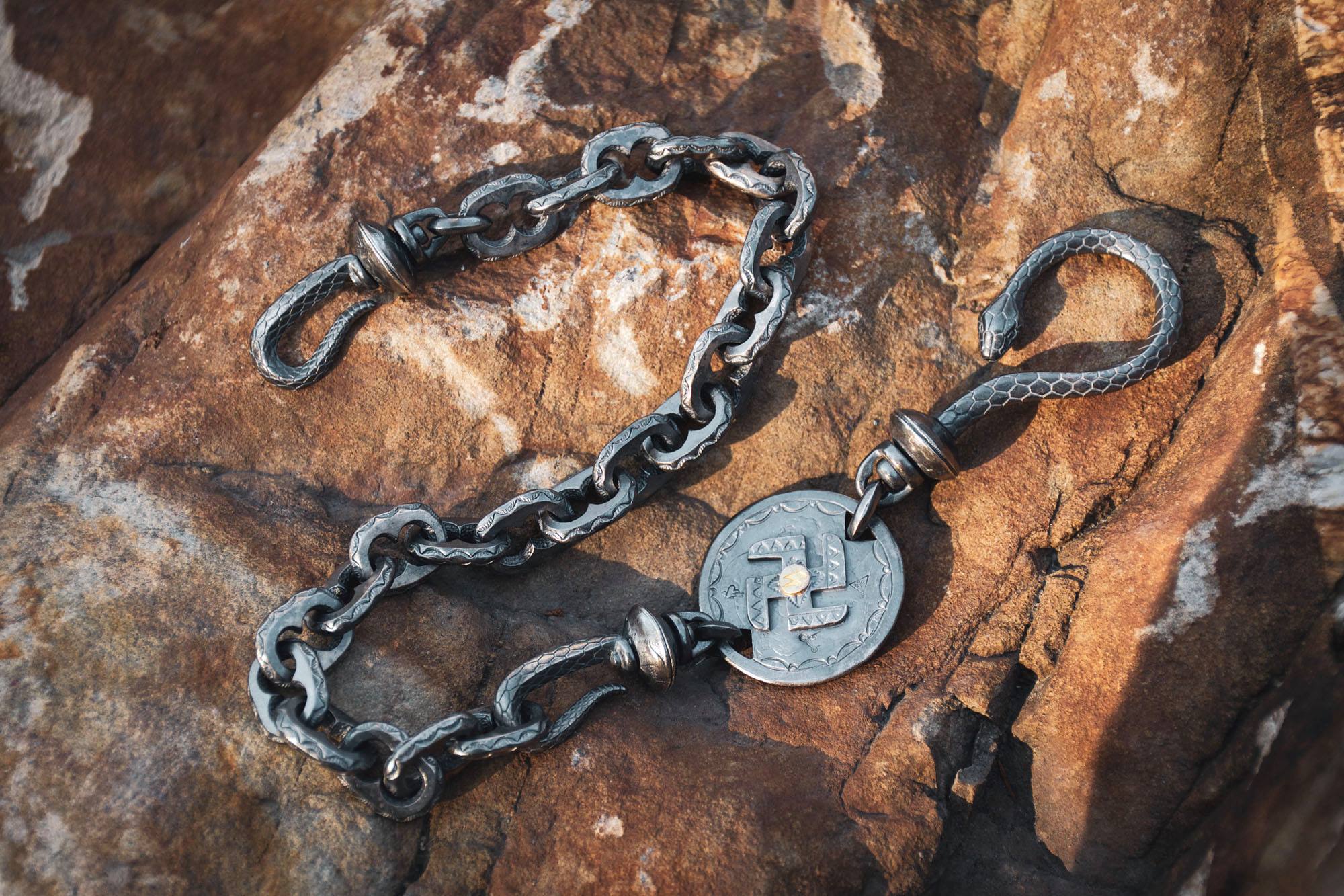SLINGSHOT SWASTIKA WALLET CHAIN by LARRY SMITH - May club